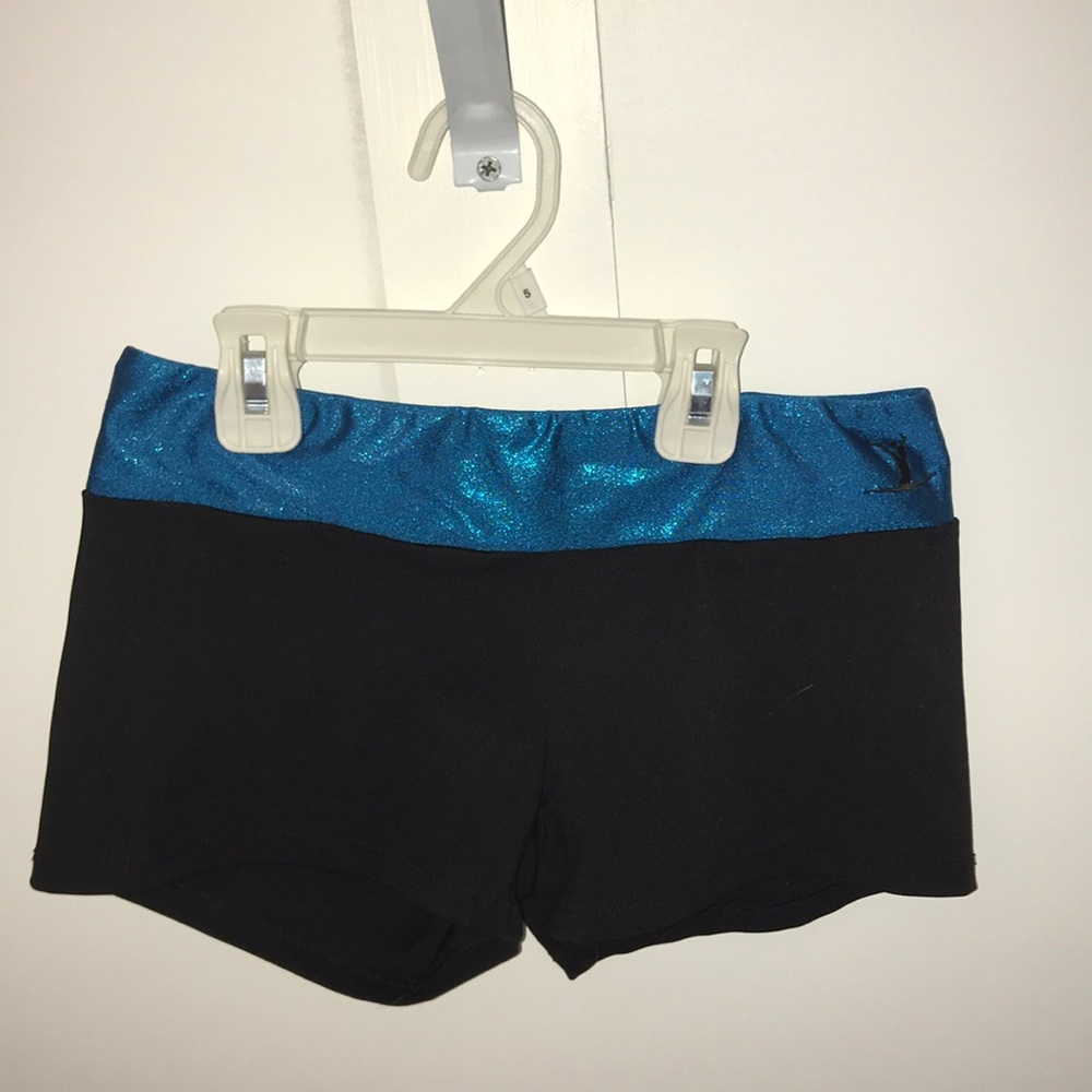 tumble wear brand black spandex with a blue waste